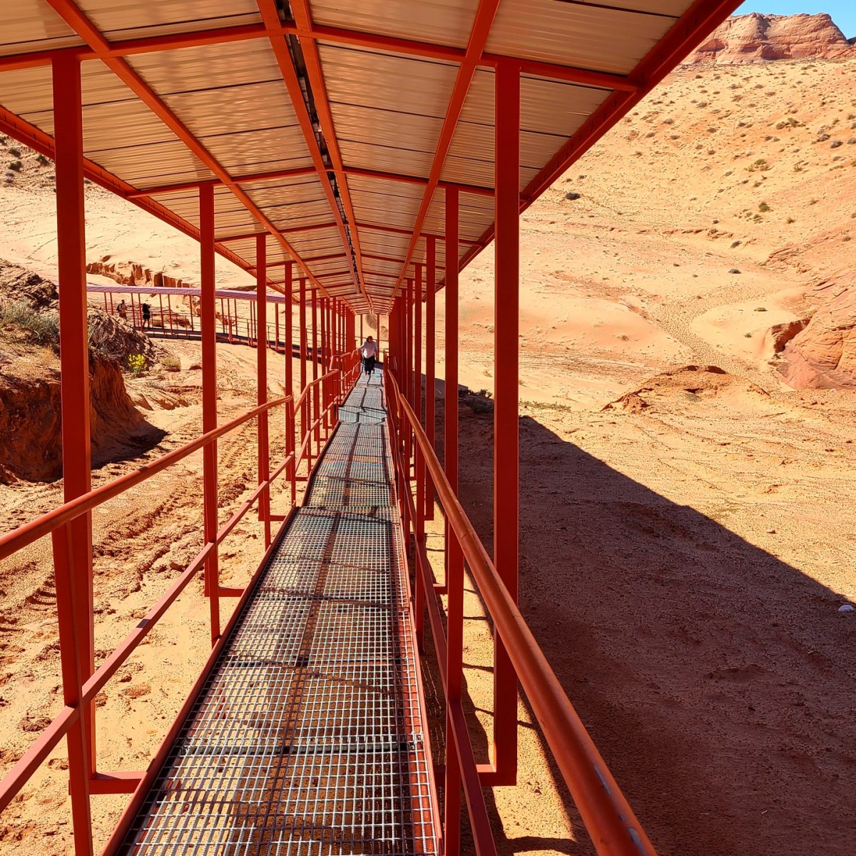 a train on a track near a fence