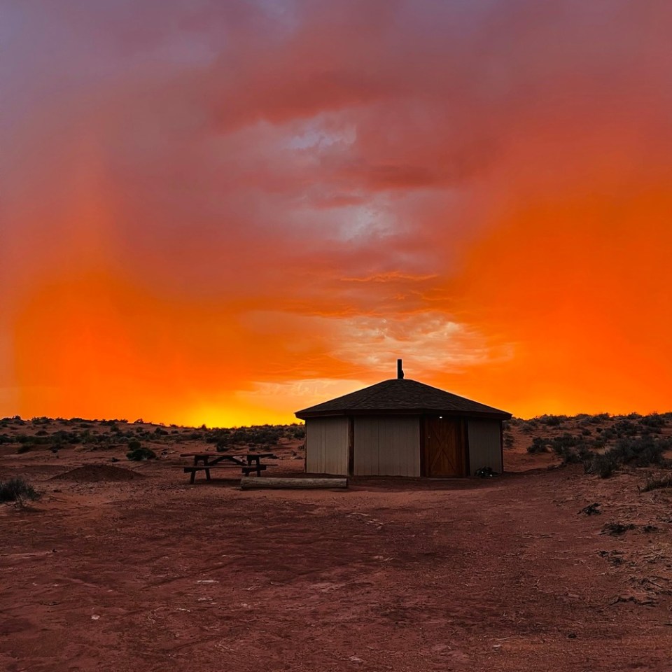 a house with a sunset in the background